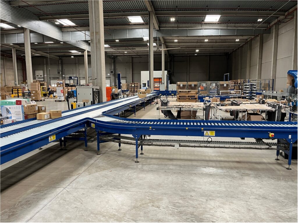 Modification de convoyeurs industriels dans une zone logistique