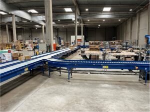 Modification de convoyeurs industriels dans une zone logistique